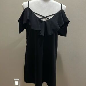 The perfect little black dress with off the shoulder ruffled sleeves.